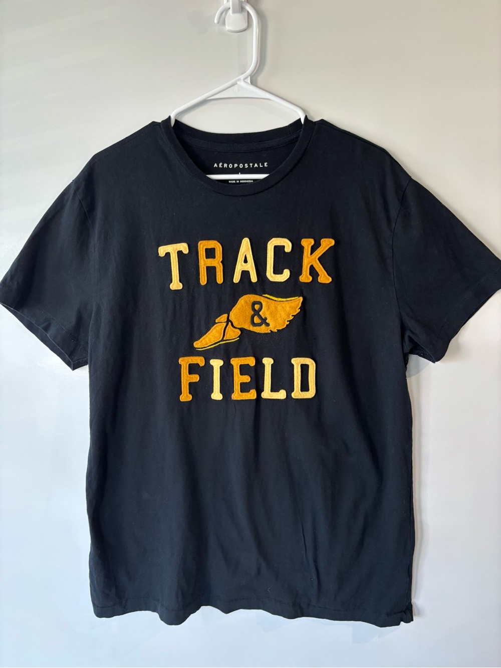Aeropostale Black Tee with Yellow Track & Field Appliqué